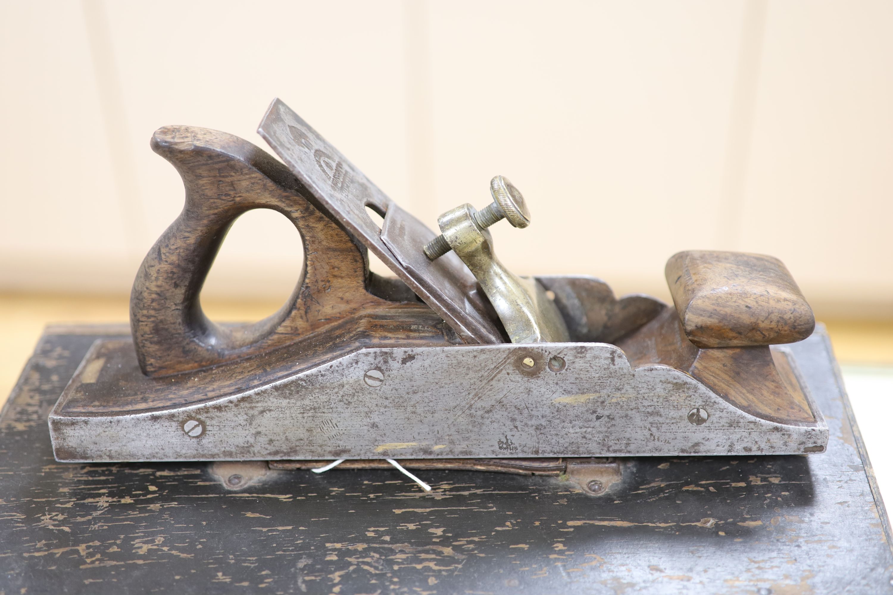 A collection of vintage tools including woodworker's planes and saws